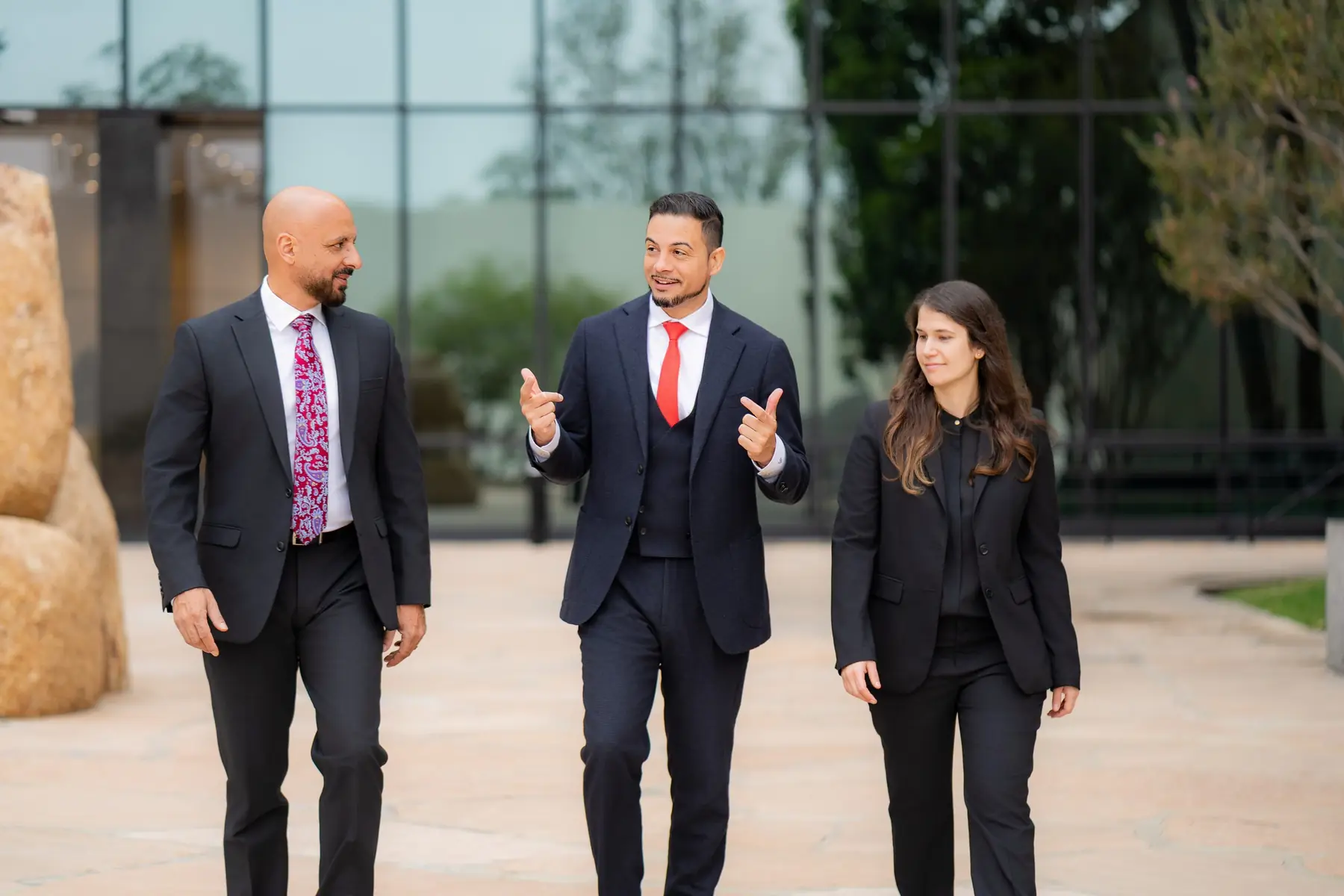 Jonathan P. LaCour, Lisa Noveck and Rony Barsoum walking together outside the office