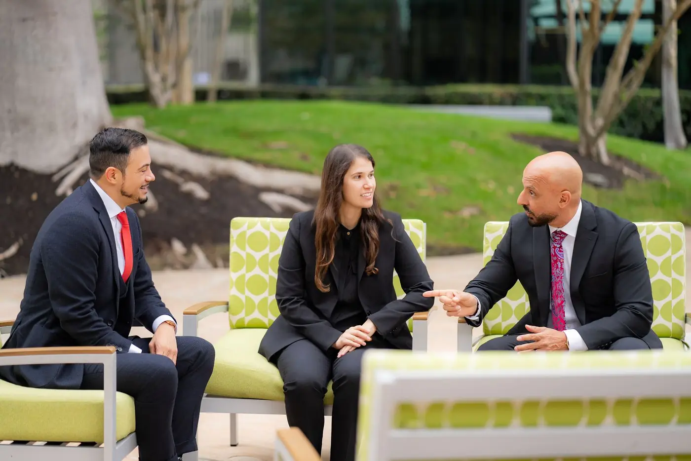 Jonathan P. LaCour, Lisa Noveck and Rony Barsoum talking together outside the office