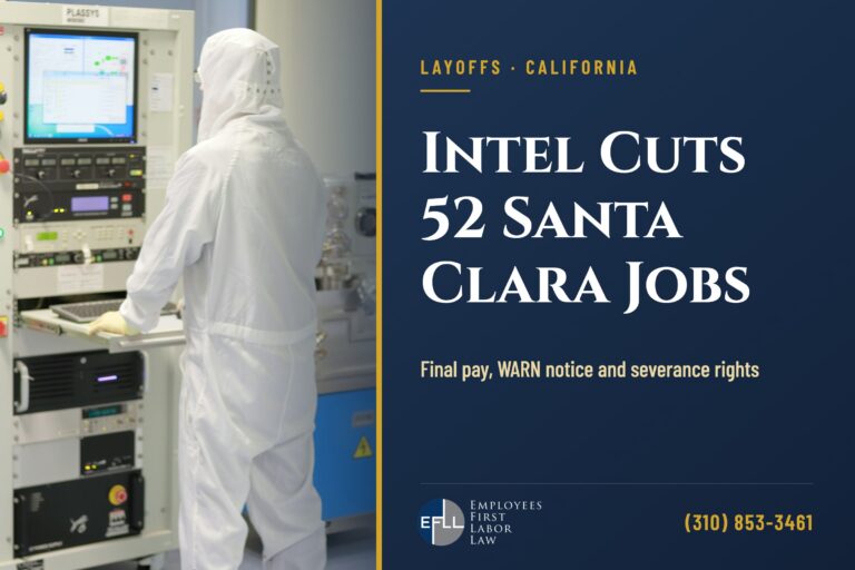 Worker in a cleanroom suit at semiconductor manufacturing equipment