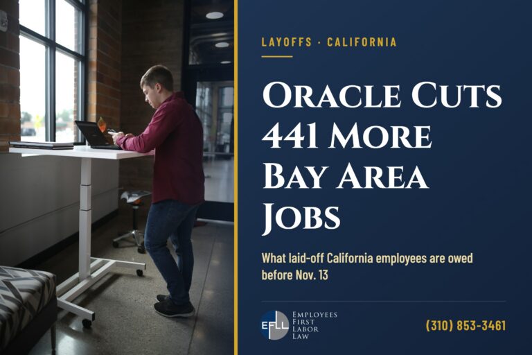 Tech worker at a standing desk in an open office