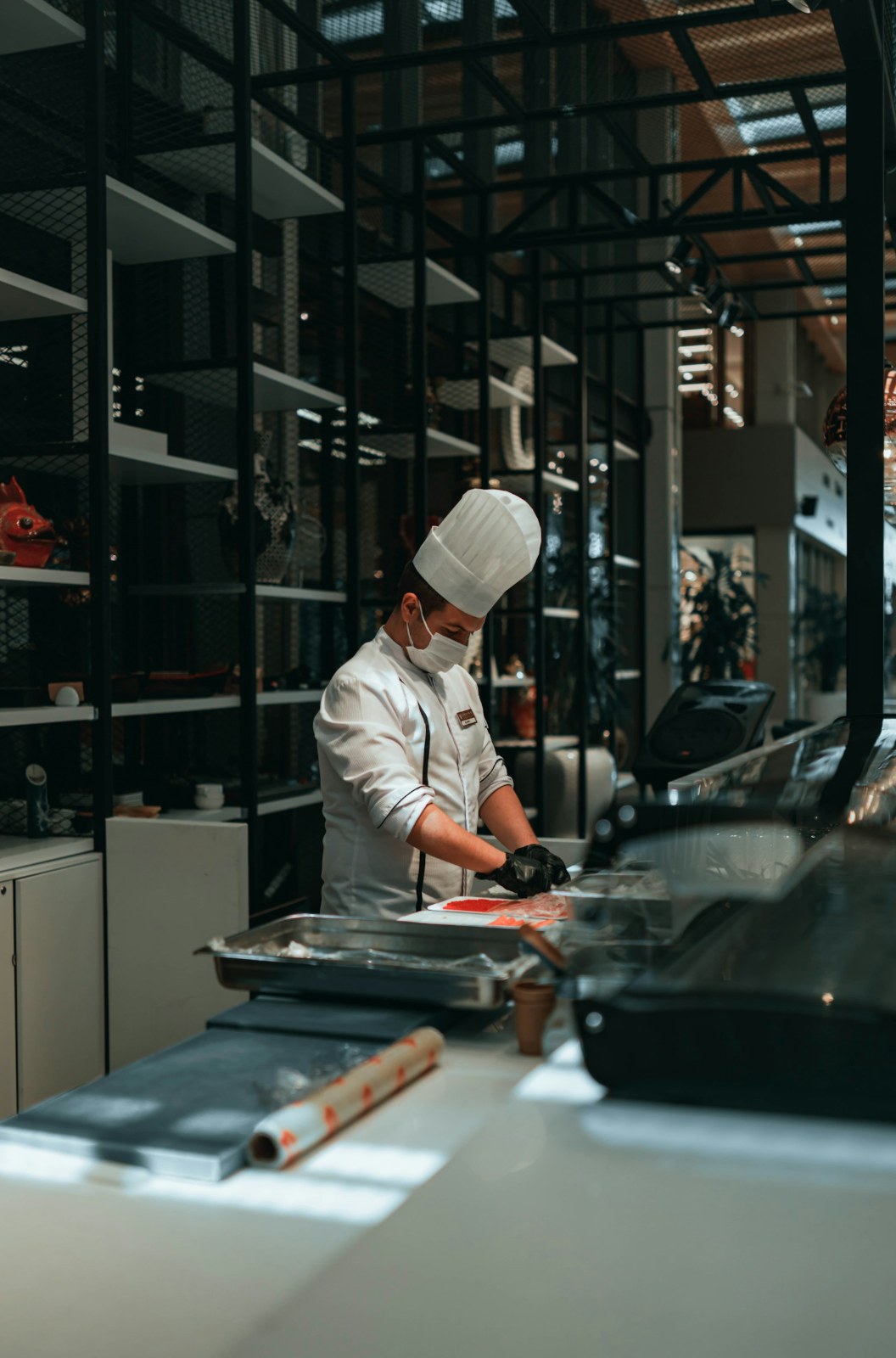 Chef preparing food at a restaurant kitchen station